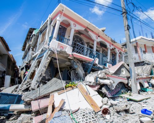FILE PHOTO: A view shows houses destroyed following a 7.2 magnitude earthquake in Les Cayes, Haiti August 14, 2021. REUTERS/Ralph Tedy Erol NO RESALES. NO ARCHIVES/File Photo